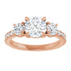 Rose gold engagement ring with three round diamonds