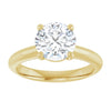 Round solitaire engagement ring in yellow gold