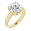 Round solitaire engagement ring in yellow gold 