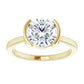Elegant round solitaire engagement ring in yellow gold