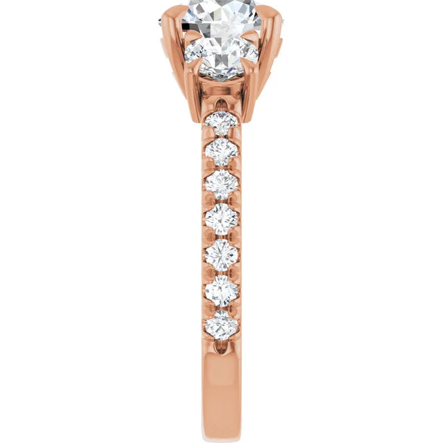 Side view of rose gold engagement ring with diamond accents