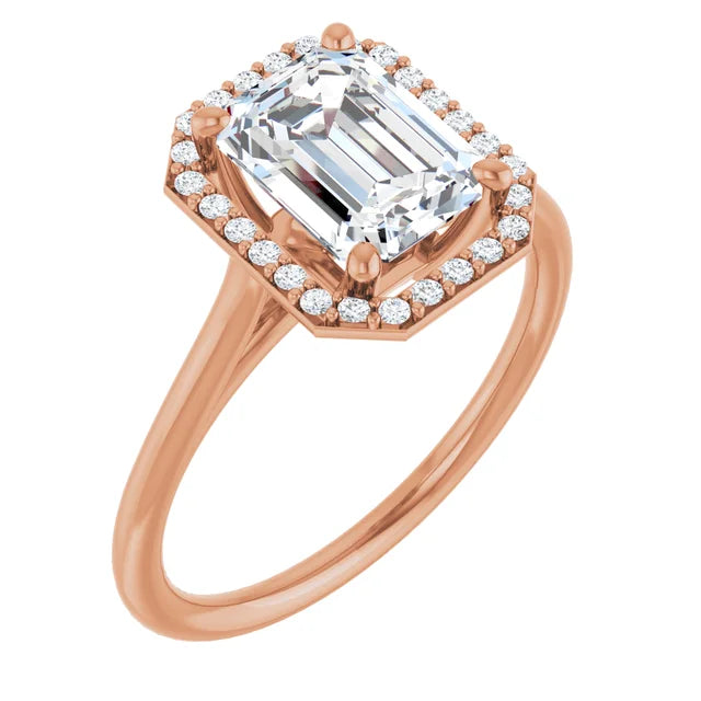 Emerald cut engagement ring with diamond halo in rose gold