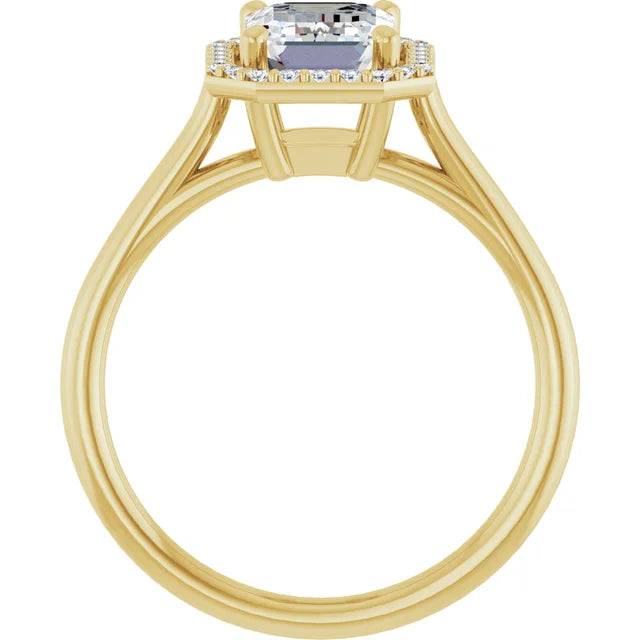 Simple emerald cut engagement ring with diamond halo in yellow gold