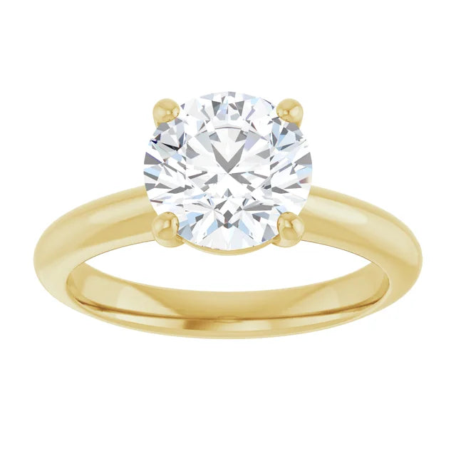 Round solitaire engagement ring in yellow gold