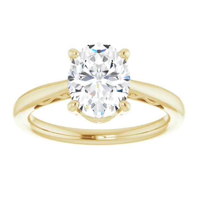 Timeless oval diamond engagement ring with a yellow gold band