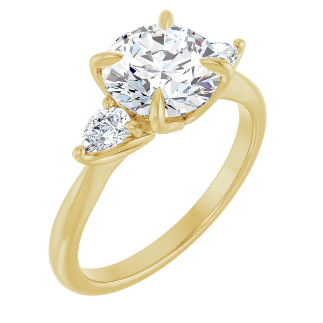Three-stone engagement ring in yellow gold