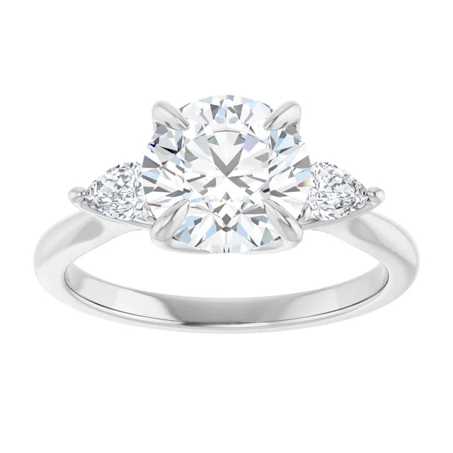 Round three-stones engagement ring in white gold