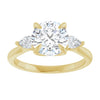 Three-stones engagement ring in yellow gold