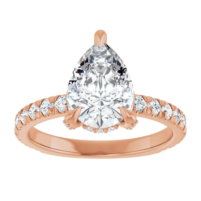 Rose gold pear cut engagement ring with hidden halo