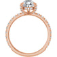 Rose gold pear engagement ring with diamond halo
