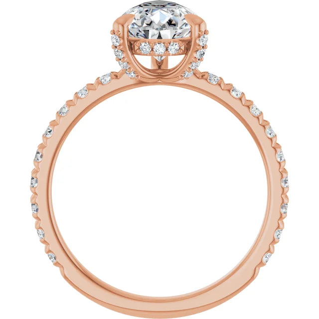 Rose gold pear engagement ring with diamond halo