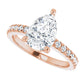 Pear engagement ring with dazzling diamonds