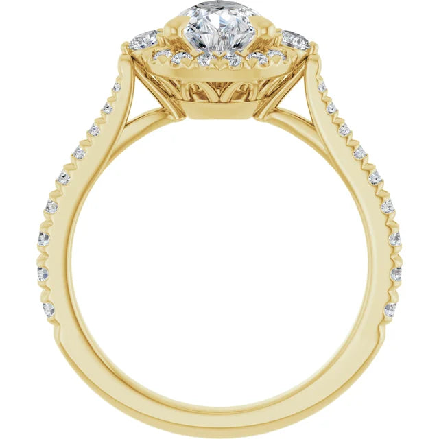 Modern emerald engagement ring with a round diamond in yellow gold