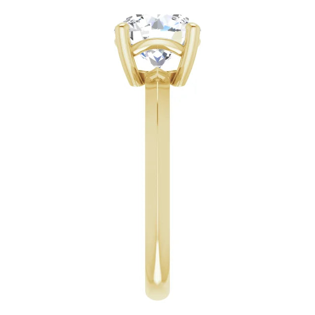 Side view of a yellow gold round solitaire engagement ring 