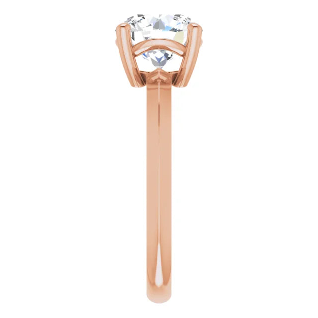 Side view of a rose gold round solitaire engagement ring 